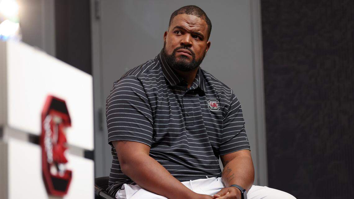 The Gamecocks’ new defensive line coach Travian Robertson looks on as he is introduced by head coach Shane Beamer during a press conference held Tuesday, May 2, 2023.