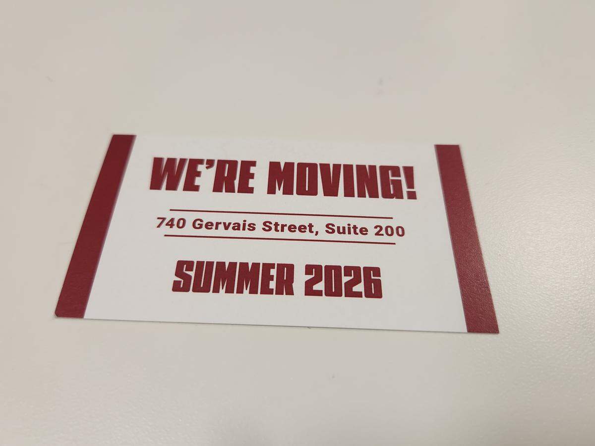 A card announces the planned upcoming move of Addam’s Gamecock Gear from Assembly Street to 740 Gervais St. suite 200.