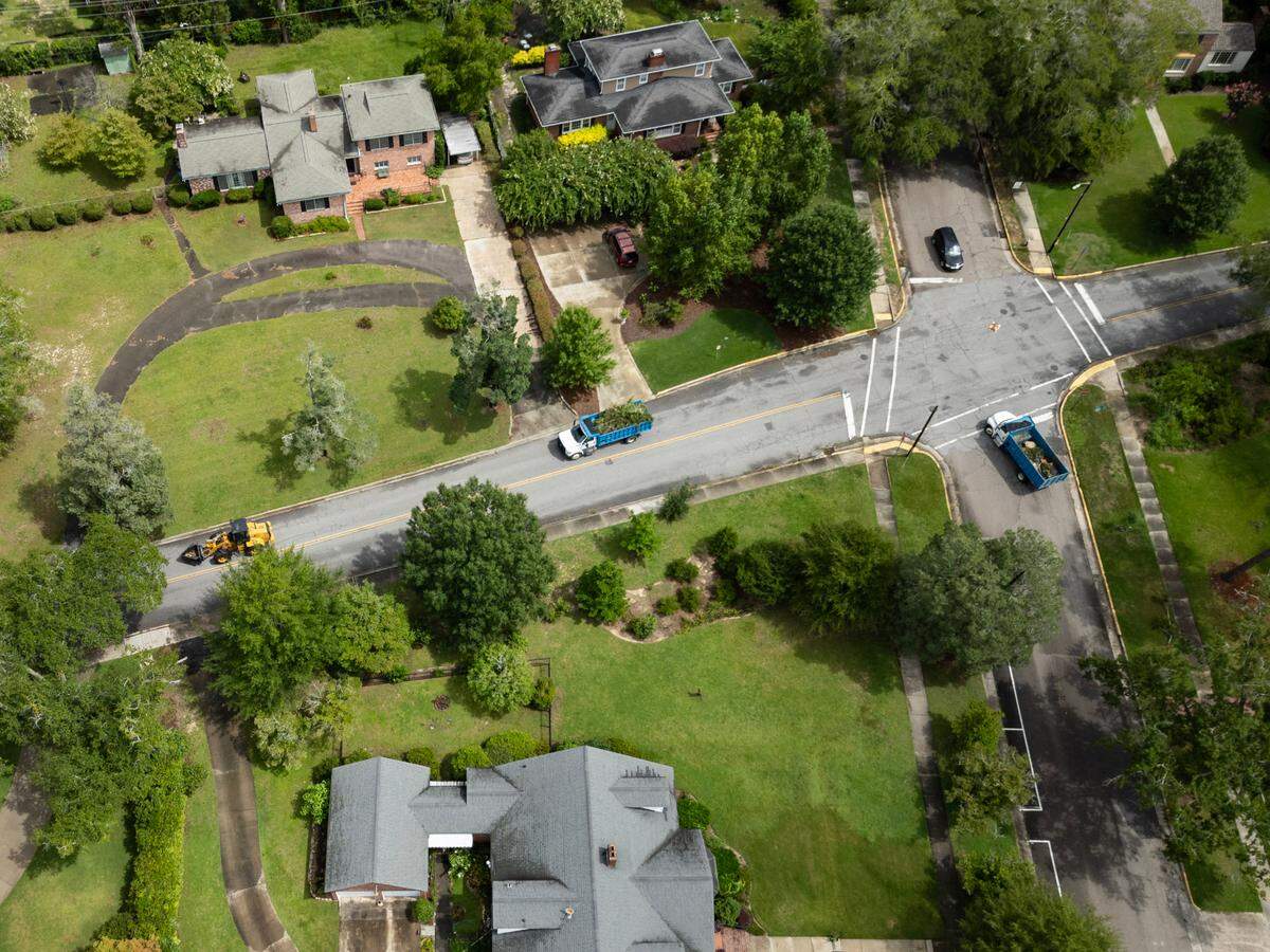 The Heathwood neighborhood in Columbia, South Carolina buzzes with the sound of workers removing downed trees and debris on Wednesday, August 7, 2024.