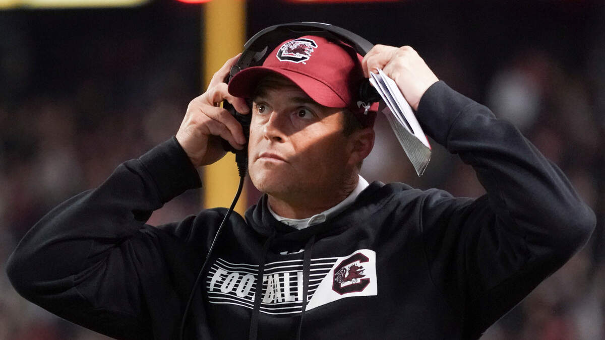 South Carolina head coach Shane Beamer looks at the stadium video screen during the second half of an NCAA college football game against Auburn Saturday, Nov. 20, 2021, in Columbia, S.C. South Carolina won 21-17. (AP Photo/Sean Rayford)