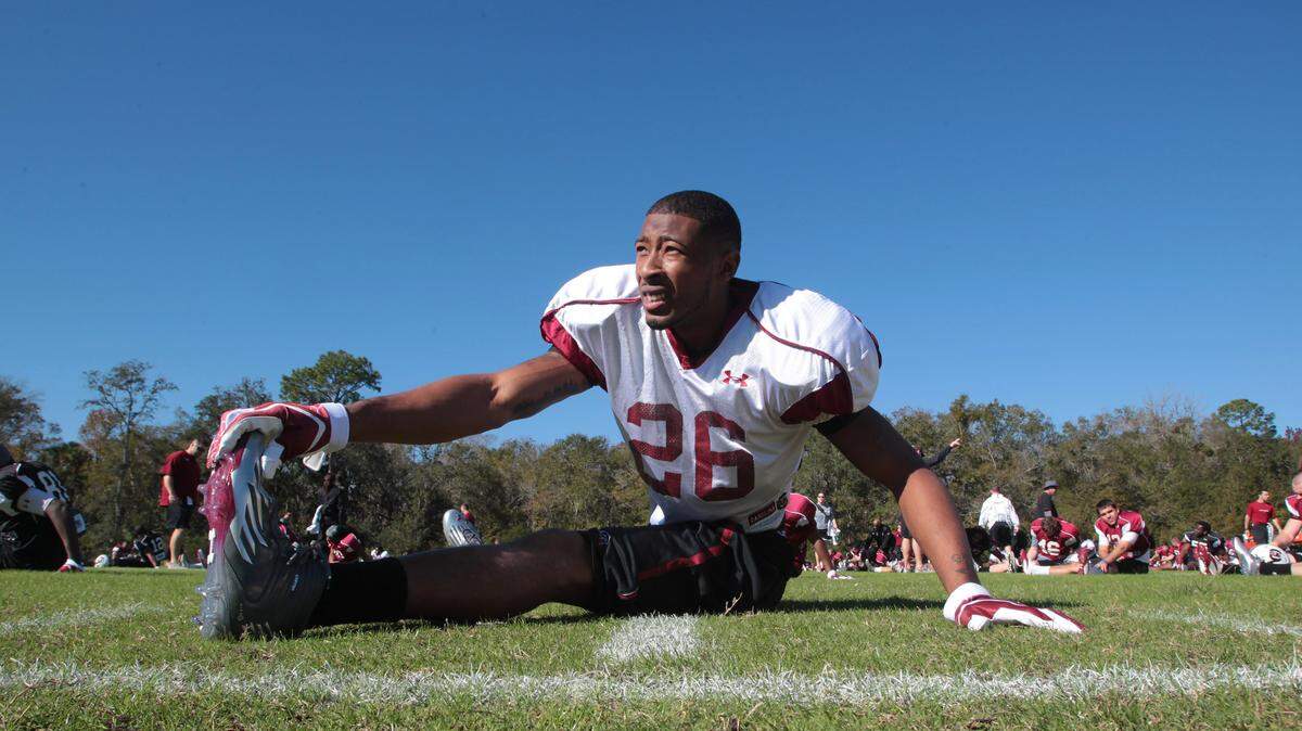 South Carolina linebacker Antonio Allen (26) stretches during the Gamecocks practice at Celebration High School, Wednesday, December 28, 2011.