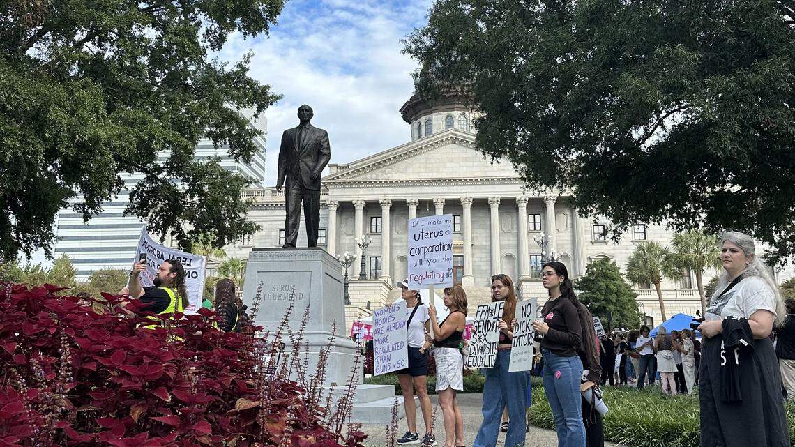Protesters gather outside the statehouse as South Carolina Senators prepare to hear testimony on a near total abortion ban Wednesday, Oct. 1, 2025 in Columbia.