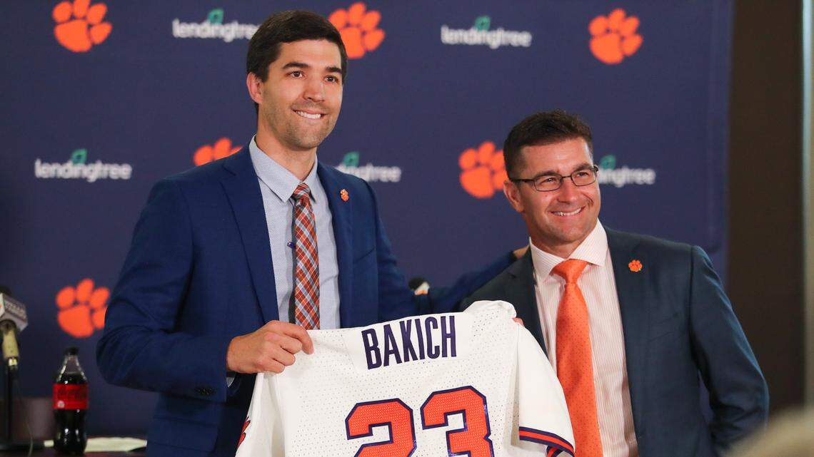 Clemson head baseball coach Erik Bakich poses for a photo with Clemson director of athletics Graham Neff during the introductory press conference at Doug Kingsmore Stadium, June 16th, 2022.