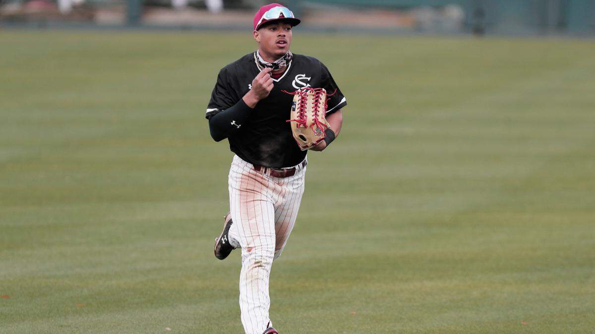 Brandon Fields #24 plays baseball at Founders Park on Tuesday, February 2, 2021. Most players and coaches wore face masks to help prevent the spread of the coronavirus.