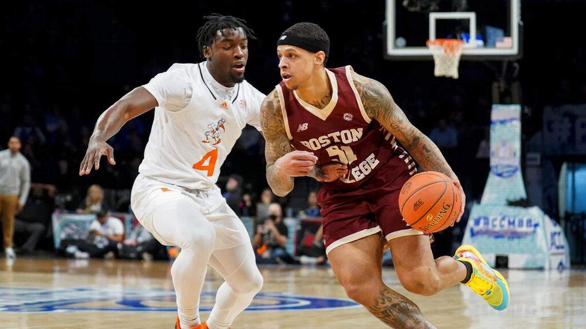 Boston College’s Brevin Galloway (51) drives against Miami’s Bensley Joseph (4) in the first half of an NCAA college basketball game during quarterfinals of the Atlantic Coast Conference men’s tournament, Thursday, March 10, 2022, in New York.