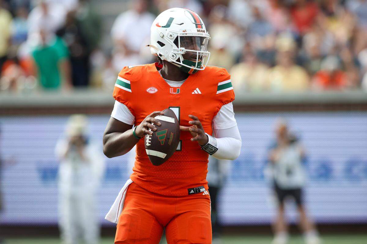 Nov 9, 2024; Atlanta, Georgia, USA; Miami Hurricanes quarterback Cam Ward (1) drops back to pass against the Georgia Tech Yellow Jackets in the third quarter at Bobby Dodd Stadium at Hyundai Field.