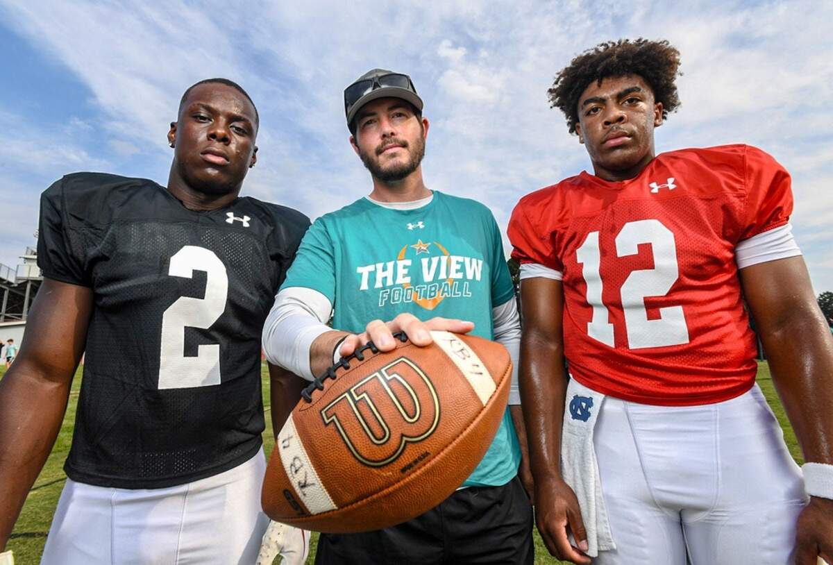 Mountain View Prep running back Jaylen McGill (2), left, Head Coach Gray Ramsey, and quarterback Bryson Drummond (12) in August 2024.