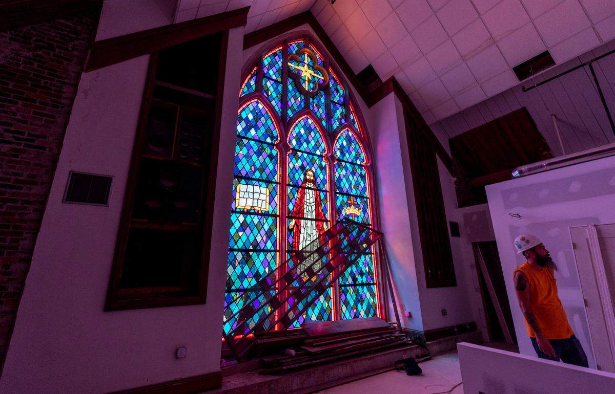 The former site of Rosewood Church is being transformed into three apartment buildings. The sanctuary of the church will include eight apartment units, one of which is built around the 30-foot-tall stained glass window from the church. The steeple will also remain in place.