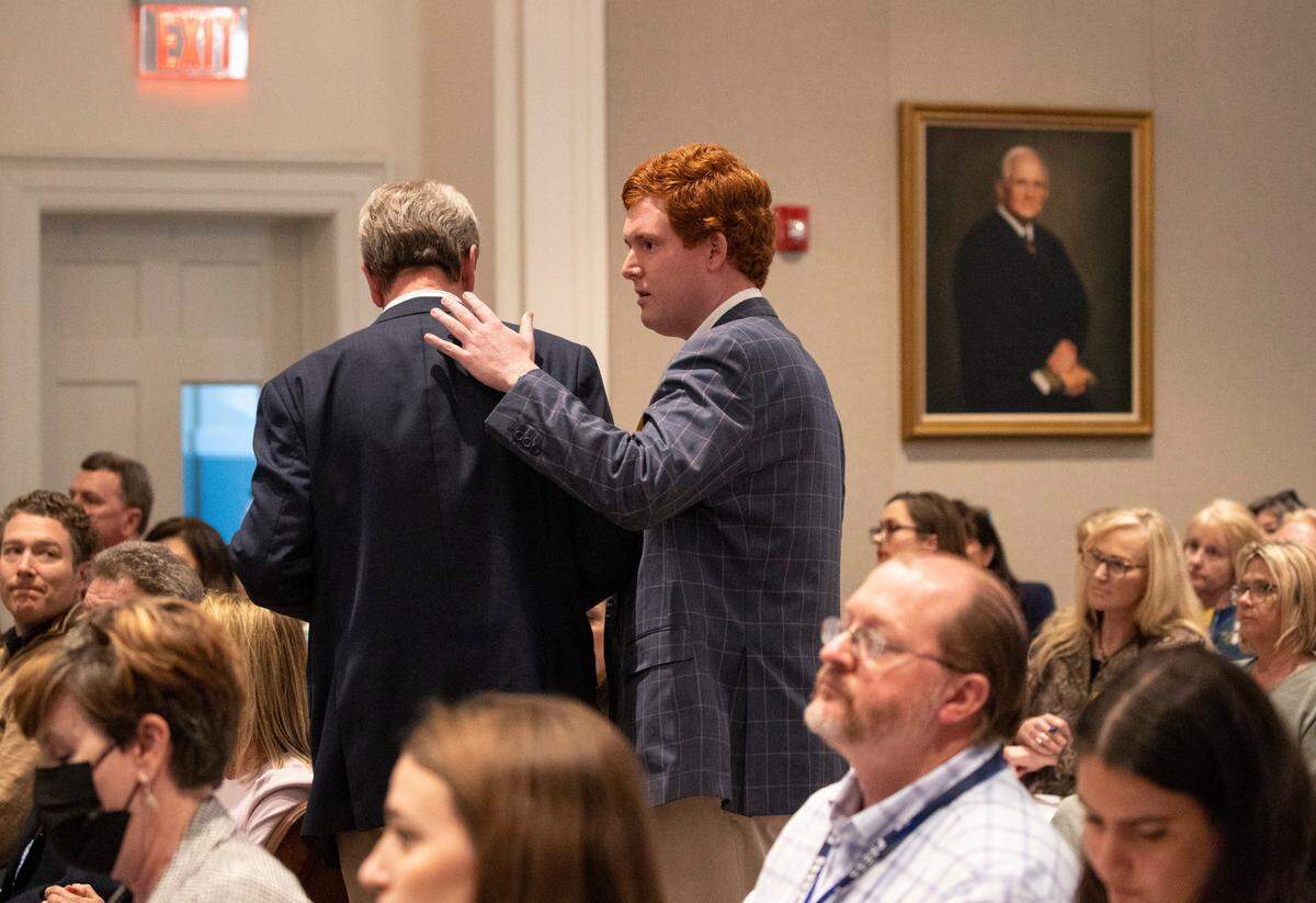 John Marvin Murdaugh is given a pat on the back by his nephew Buster Murdaugh during the Alex Murdaugh double murder trial at the Colleton County Courthouse in Walterboro on Day 25 of Monday, Feb. 27, 2023. Andrew J. Whitaker/The Post and Courier/Pool