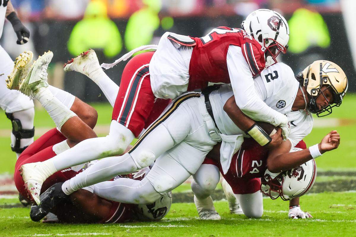 Vanderbilt Commodores quarterback Walter Taylor (2) is tackled by South Carolina Gamecocks linebacker Bam Martin-Scott (22) in the second quarter at Williams-Brice Stadium in 2023.