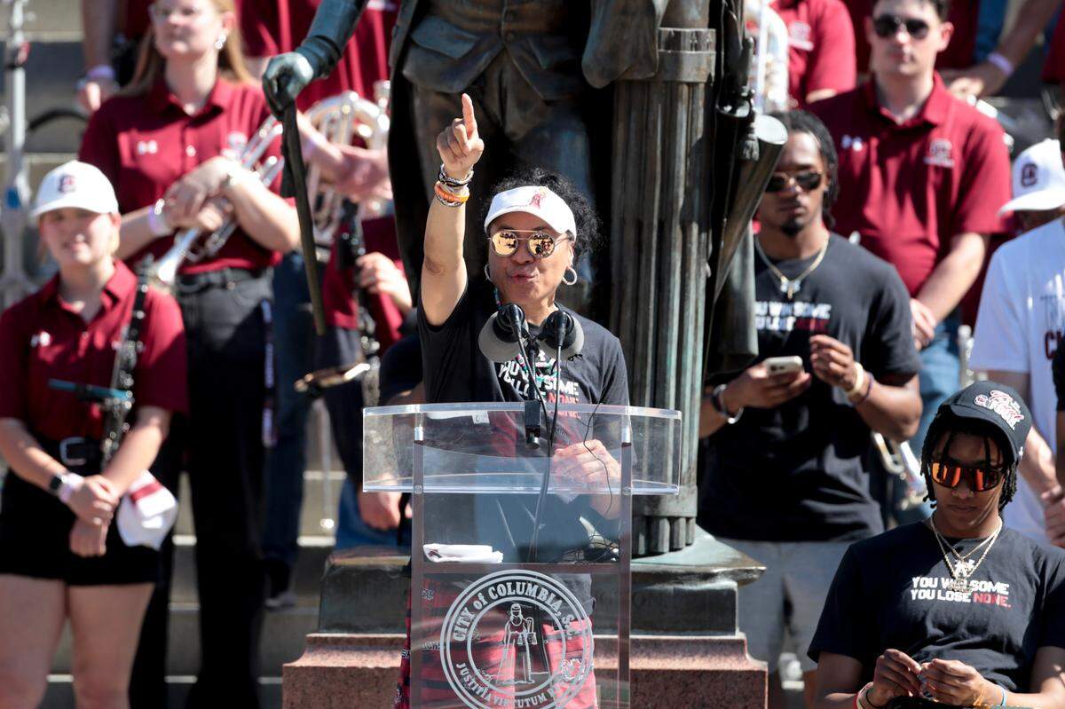 University of South Carolina Head Coach Dawn Staley acknowledges the fans after a parade through downtown Columbia and a ceremony at the South Carolina State House on Sunday, April 14, 2024. The Gamecocks women’s basketball team won the National Championship after having an undefeated season.