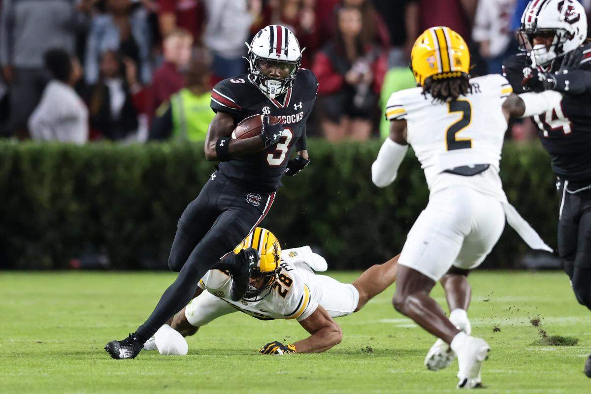 South Carolina wide receiver Mazeo Bennett Jr. (3) dodges the tackle of Missouri safety Joseph Charleston (28) during the first half of the Gamecocks’ game against Missouri at Williams-Brice Stadium in Columbia on Saturday, November 16, 2024.