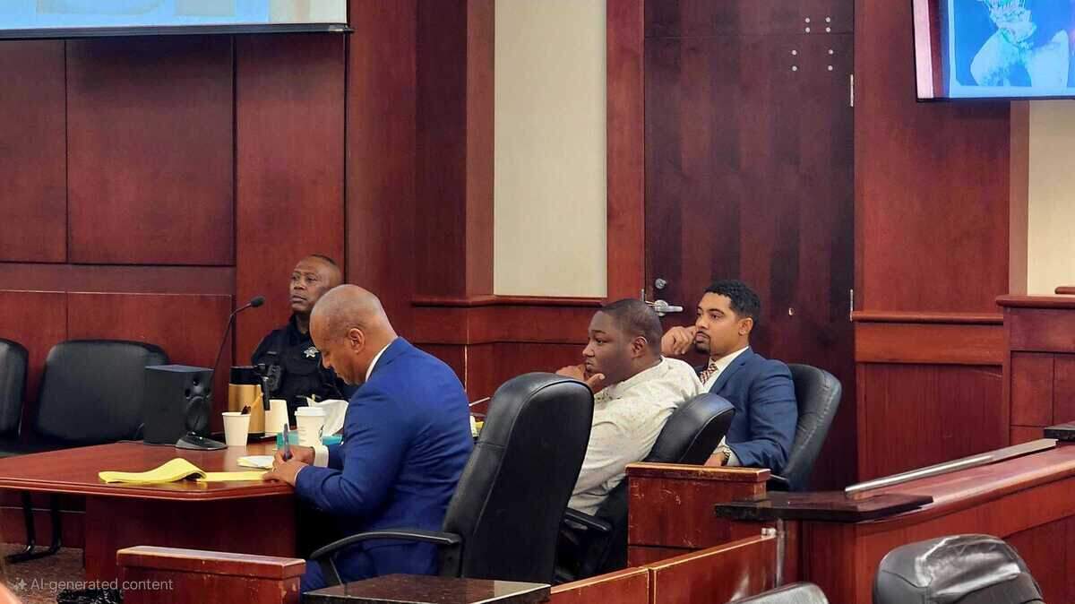 Jewayne Price sits between his two lawyers, and watches as 11th Circuit Solicitor Rick Hubbard delivers closing arguments before a jury on October 31, 2024.