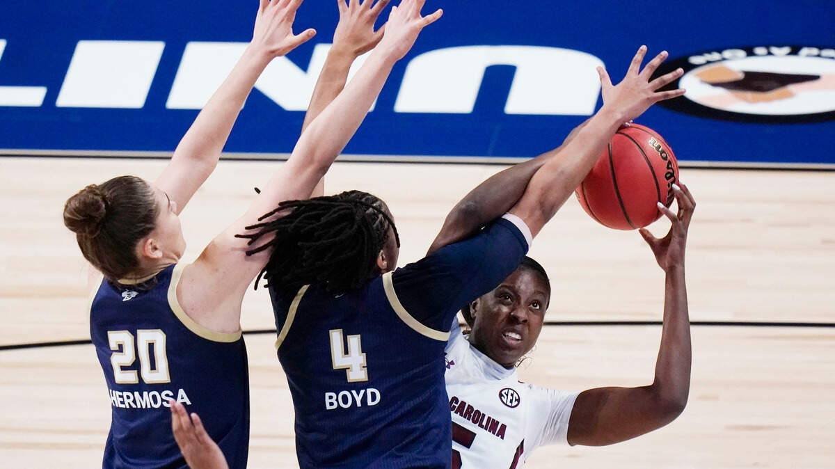 South Carolina forward Laeticia Amihere, right, shoots against Georgia Tech center Nerea Hermosa (20) and guard Anaya Boyd (4) during the first half of a college basketball game in the Sweet Sixteen round of the women’s NCAA tournament at the Alamodome in San Antonio, Sunday, March 28, 2021.
