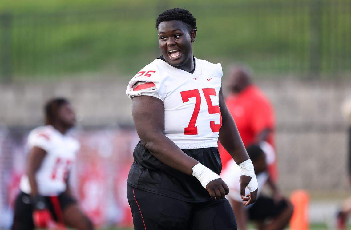 Anthony Baxter (75) of South Pointe warms up before AC Flora’s game against South Pointe at Memorial Stadium on Friday, September 19, 2025.