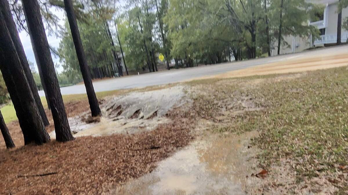 Water pouring from break under Columbia road forces closure of Harbison Blvd