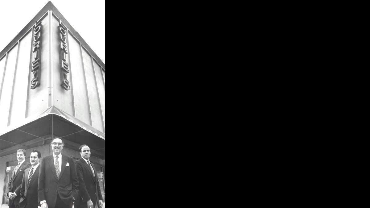 The Louries -- from left Barry Lourie, Louis Lourie, Mick Lourie, Frank Lourie -- during the family's 75th year in the apparel business.