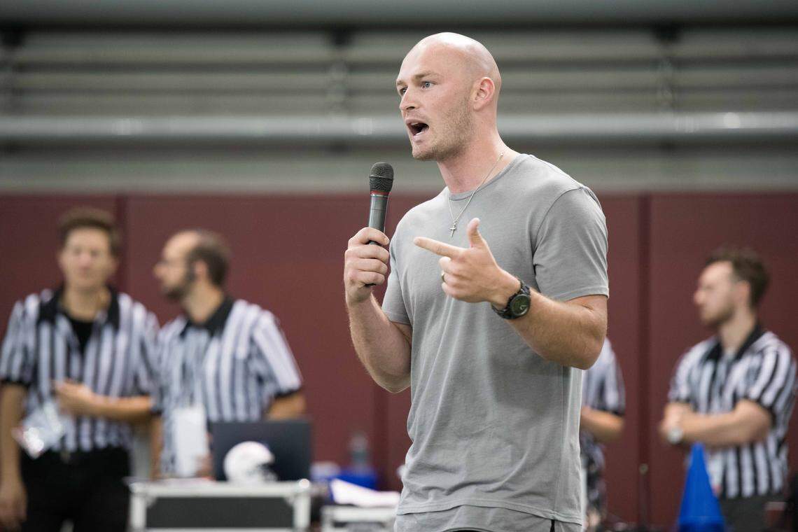 Former Gamecock quarterback Connor Shaw speaks to the crowd during the All Pro Dad Father and Kids Experience at the University of South Carolina indoor practice facility on June 30, 2018, in Columbia, S.C.