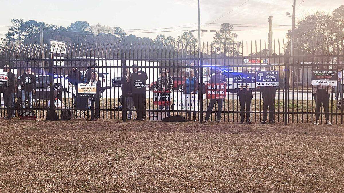 Shortly after it was announced that Brad Sigmon had been excuted via a firing squad, protesters quietly lined the fence, holding various signs, in front of the Broad River Correctional Institution on Friday, March 7, 2025.