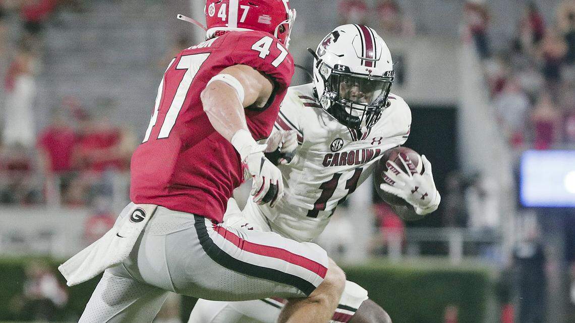 Georgia Bulldogs defensive back Dan Jackson (47) guards South Carolina Gamecocks running back ZaQuandre White (11) at Sanford Stadium on Saturday, September 18, 2021.