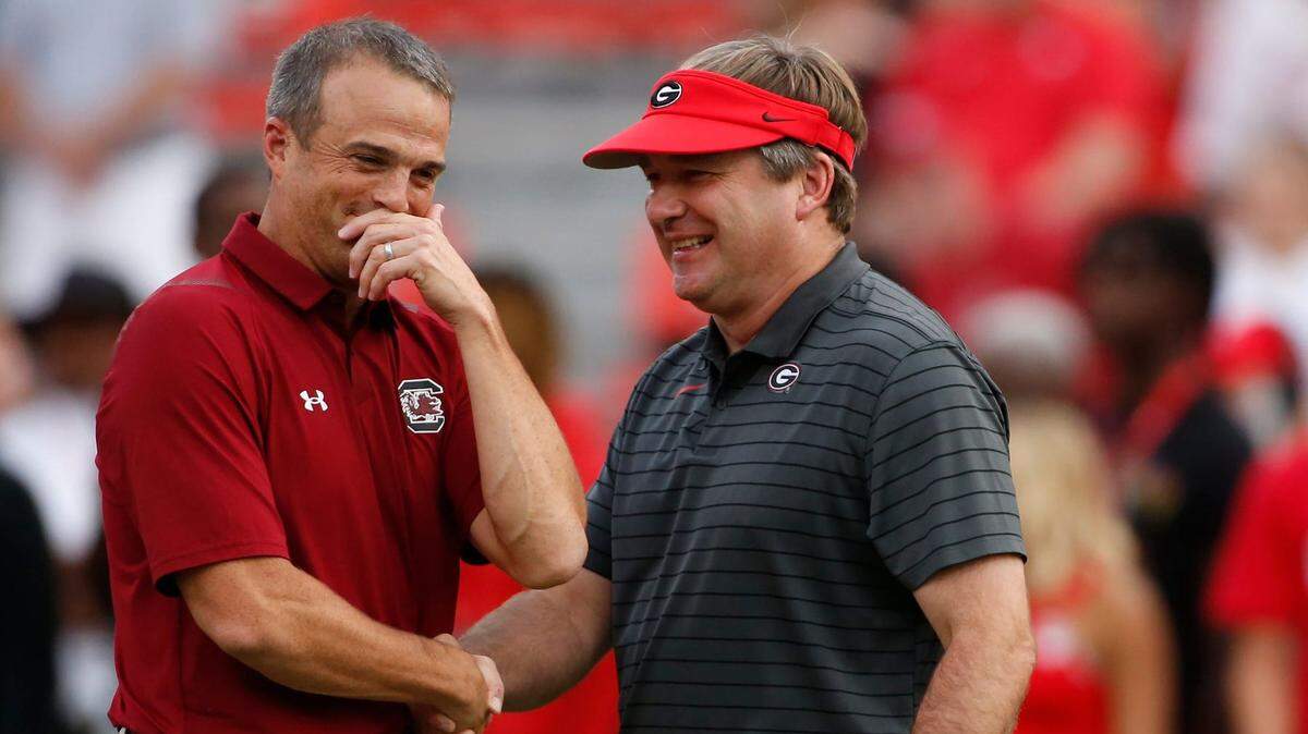 Georgia Bulldogs coach Kirby Smart (right) and South Carolina Gamecocks head coach Shane Beamer (left) speak before kickoff at Sanford Stadium in 2021.