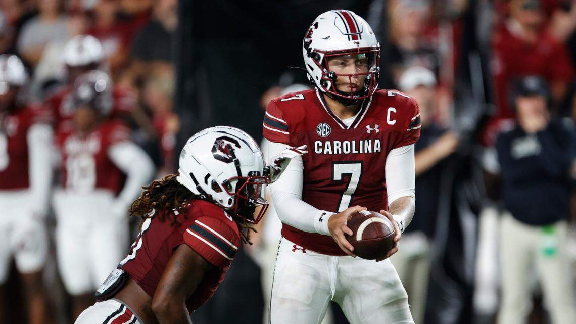 South Carolina quarterback Spencer Rattler (7) fakes a pass to South Carolina running back Juju McDowell (0) during the game against Furman at Williams-Brice Stadium on Saturday, September 9, 2023.