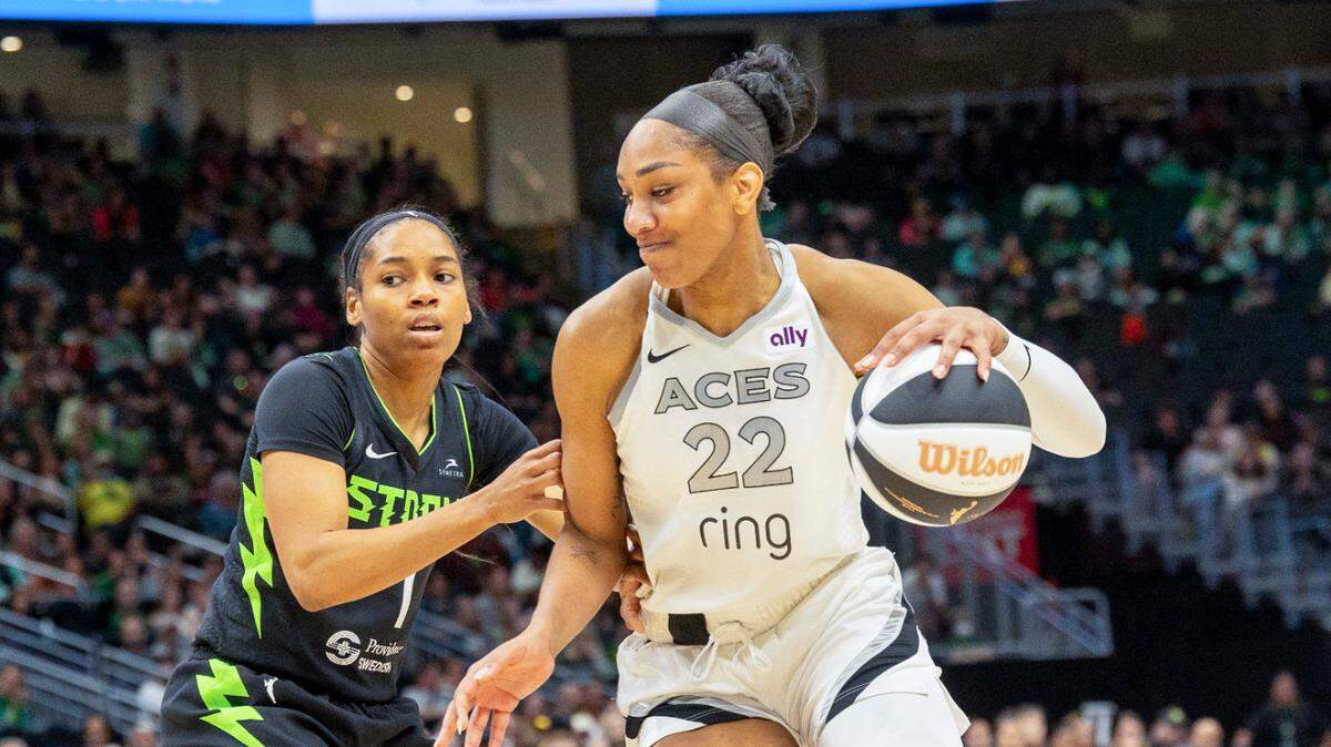 Jun 1, 2025; Seattle, Washington, USA; Las Vegas Aces center A’ja Wilson (22) takes the ball towards to the basket against Seattle Storm guard Zia Cooke (7) in the fourth period at Climate Pledge Arena.
