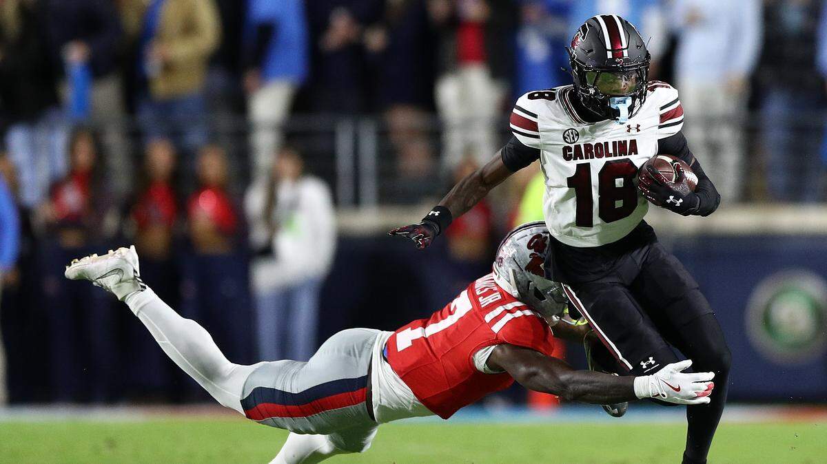 Brian Rowe Jr. #18 of the South Carolina Gamecocks carries the ball against TJ Banks #7 of the Mississippi Rebels during the first half at Vaught-Hemingway Stadium on November 01, 2025 in Oxford, Mississippi.