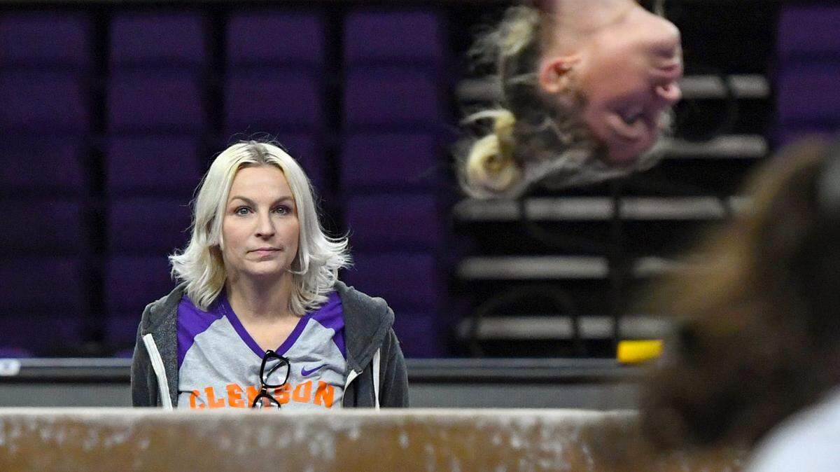 Clemson Head Coach Amy Smith watches a gymnast on a balance beam, during gymnastics practice at Littlejohn Coliseum in Clemson, S.C. Tuesday, Oct 17, 2023.