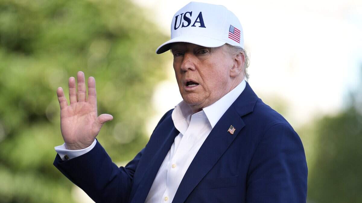 U.S. President Donald Trump waves to reporters on the South Lawn at the White House on Sunday, July 6, 2025. (Yuri Gripas/Abaca Press/TNS)
