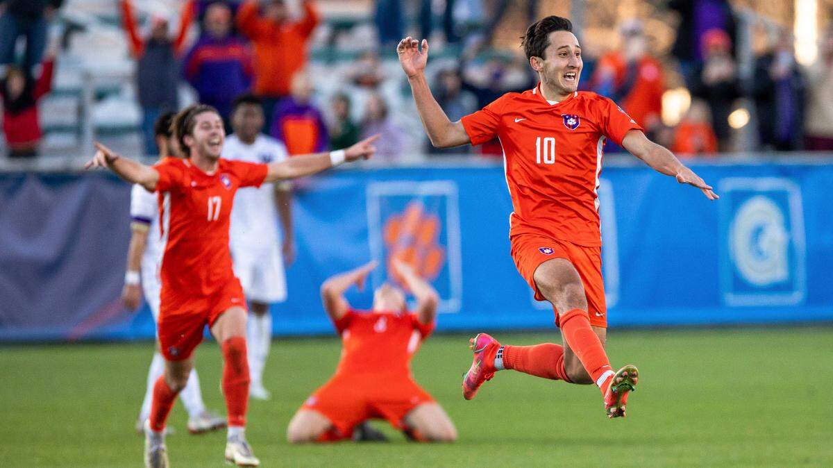 Clemson’s Luis Felipe Fernandez-Salvador (10) celebrates with teammates after defeating Washington in the NCAA college soccer tournament championship in Cary last month.