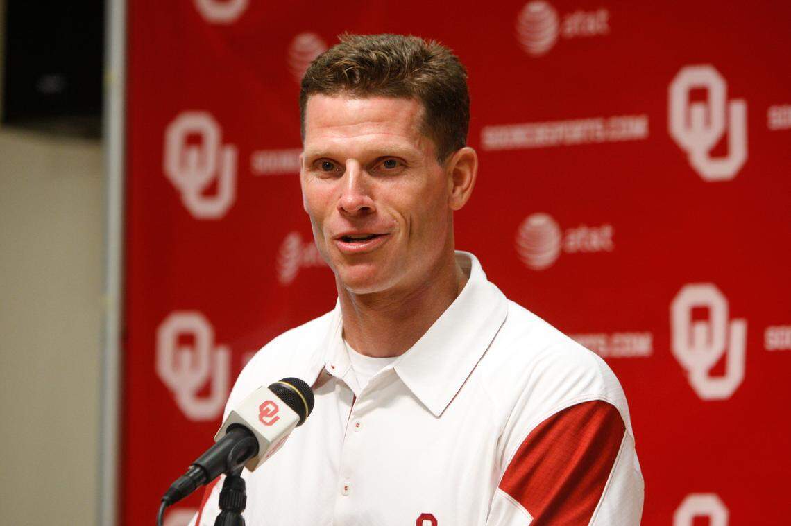 From Aug. 6, 2010, then-Oklahoma defensive coordinator Brent Venables answers a question during a news conference at media day in Norman, Okla.