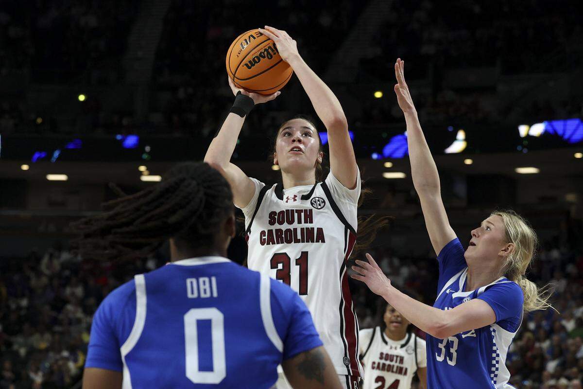 South Carolina's Alicia Tournebize (31) shoots as Kentucky’s Josie Gilvin (33) pressures during the second half of action of their women's basketball game in the SEC Tournament, against Kentucky at the Bon Secours Wellness Arena on Friday, March 6, 2026. The Gamecocks advanced after beating Kentucky 87-64.