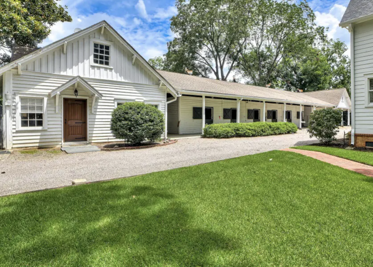 The five bedroom, four bath farmhouse at 248 Marion Street SE was built in 2018 along the tree-lined streets of Old Aiken. It has a 16-stall stable.