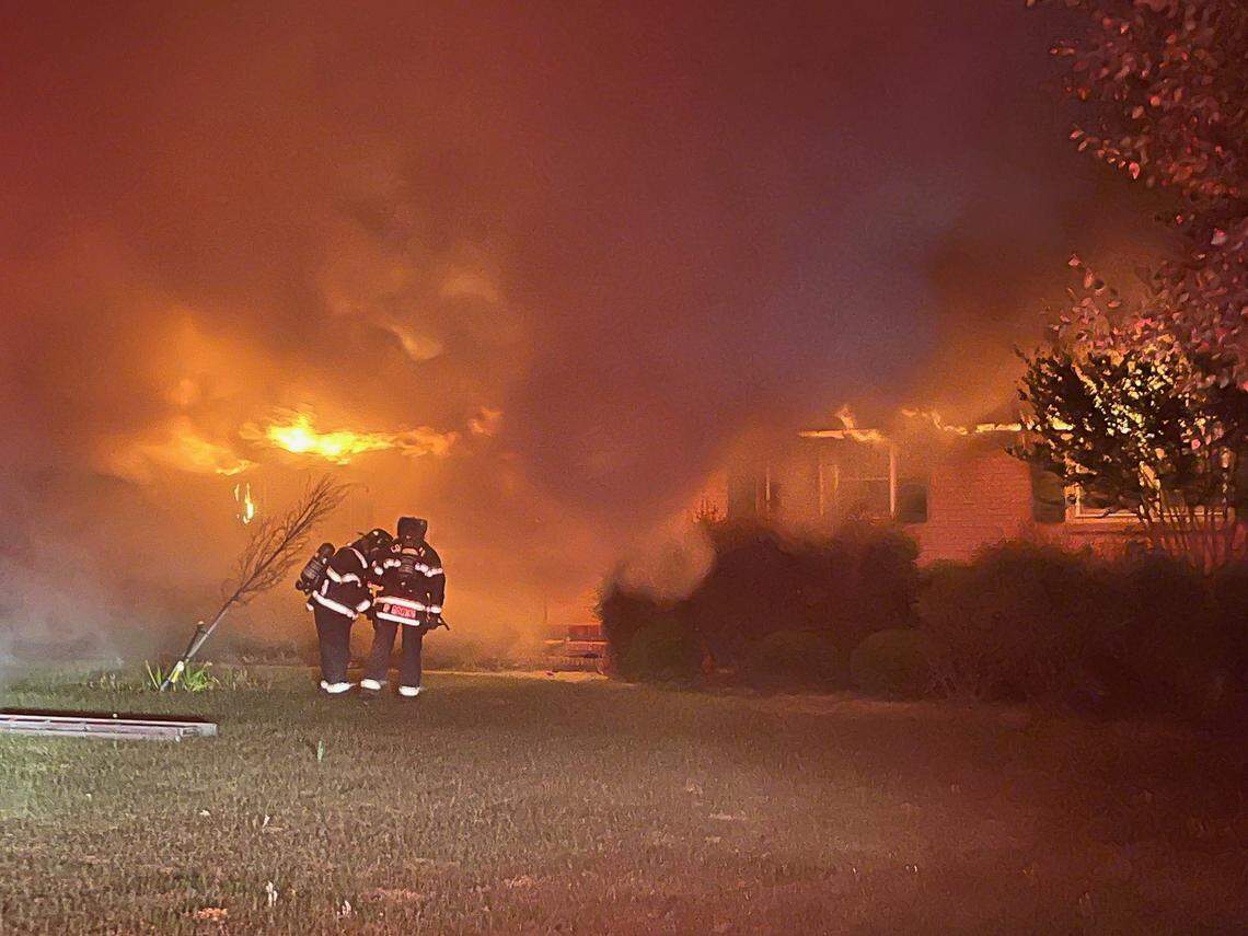 Members of the Columbia Fire Department battle a blaze early Thursday morning.