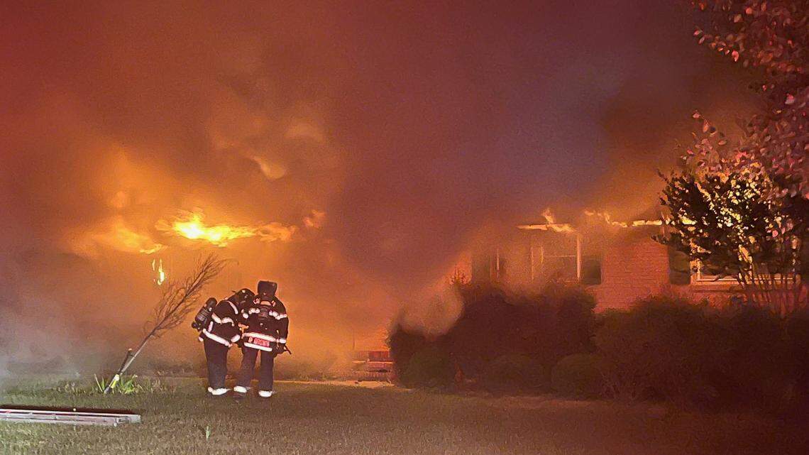 Members of the Columbia Fire Department battle a blaze early Thursday morning.