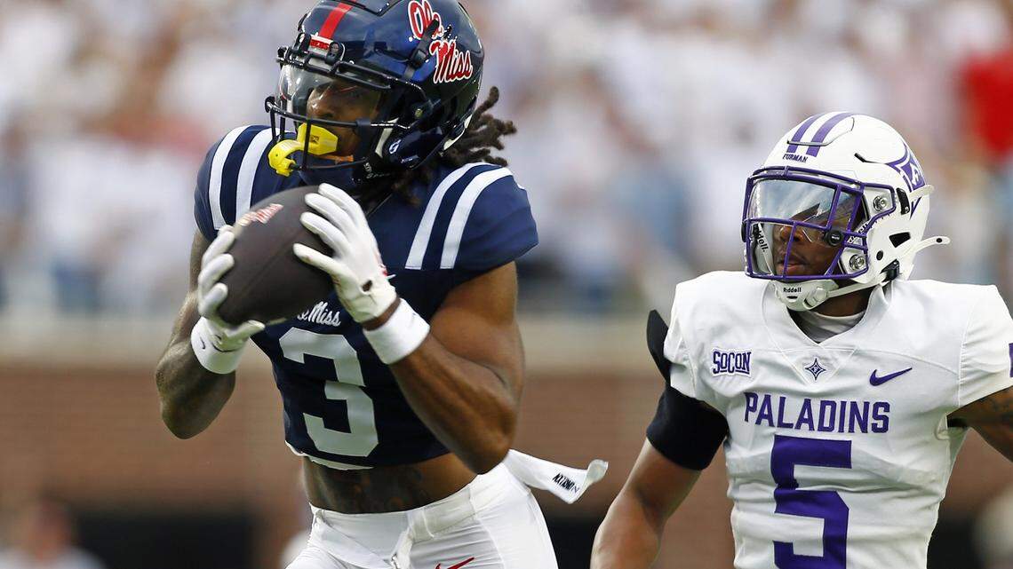 Mississippi Rebels wide receiver Antwane Wells Jr. (3) catches the ball against Furman Paladins defensive back Hysan Dalton (5) during the first half at Vaught-Hemingway Stadium.