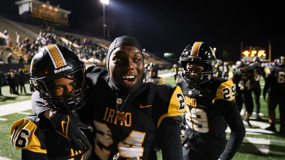 Jaiden Bryant (24) and Zion Gates (16) of Irmo celebrate their win over White Knoll in their Class 5A Division II semifinal game in Irmo on Friday, December 6, 2024. 
