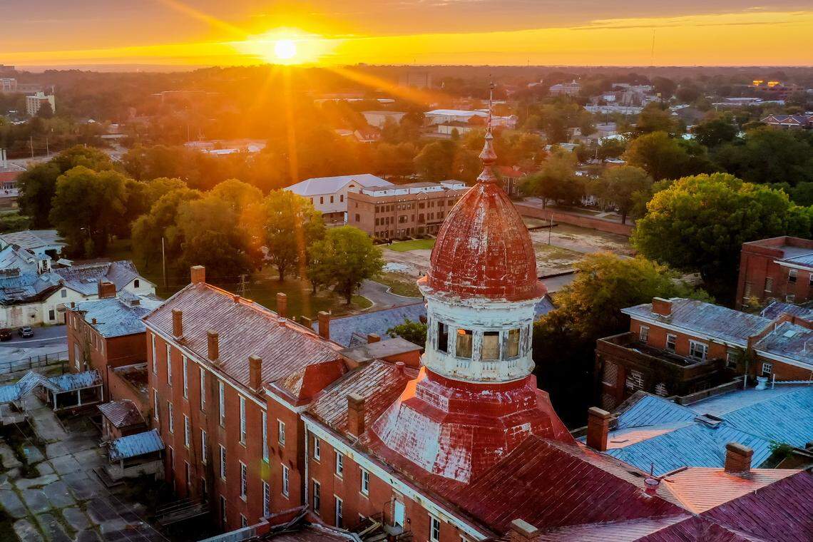 Sun rises over the historic Babcock Building in the BullStreet District near downtown Columbia, SC, on 10/13/18.