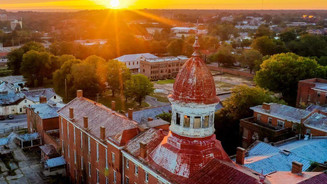 Sun rises over the historic Babcock Building in the BullStreet District near downtown Columbia, SC, on 10/13/18.