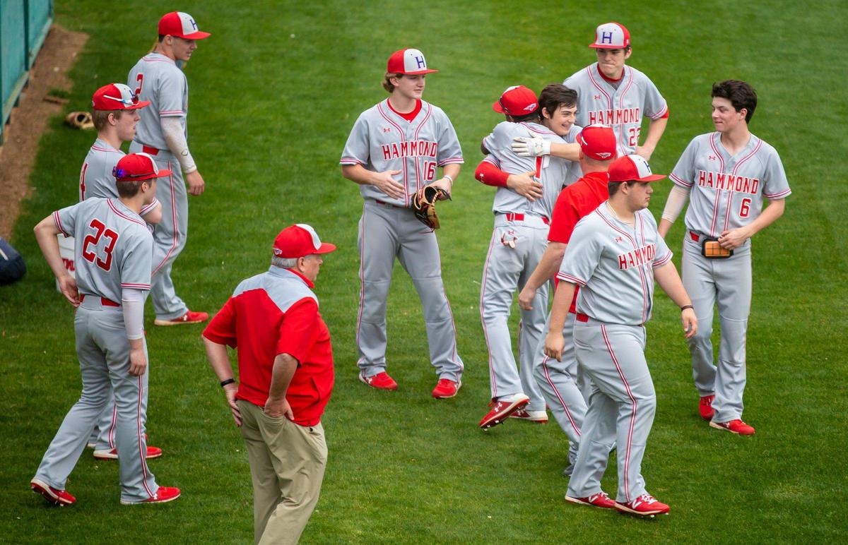 Hammond players embrace as their senior teammates our recognized at Heathwood Hall before their final game before the suspension of the season due to the coronavirus. 