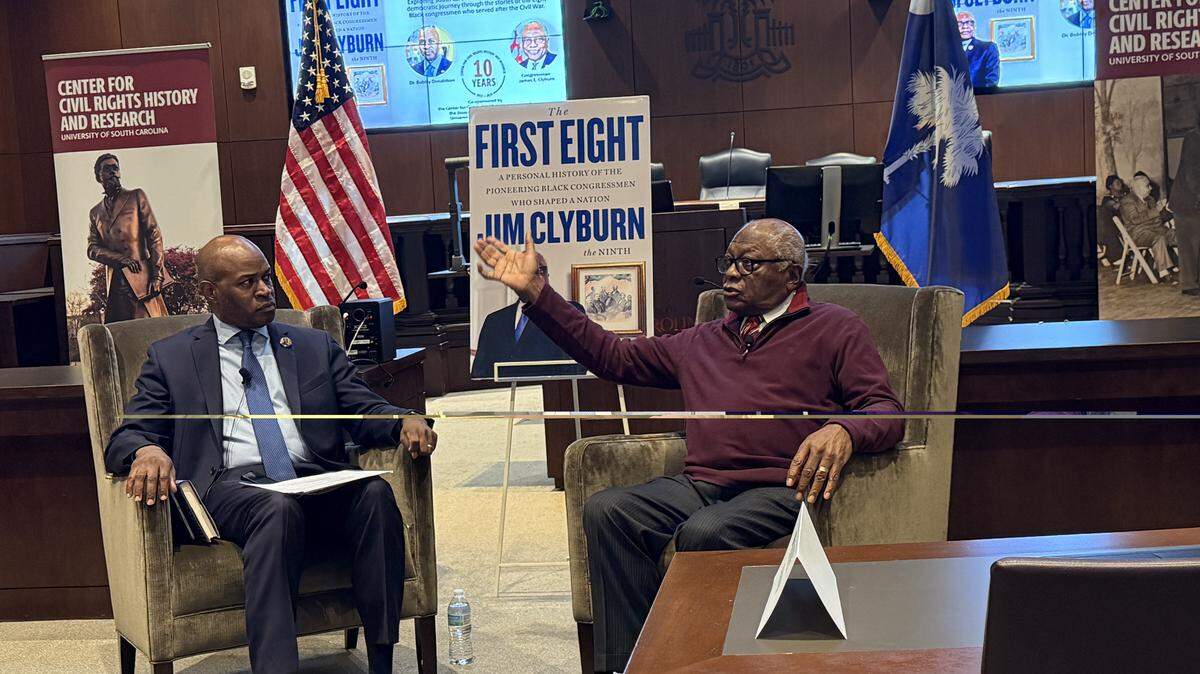 US Rep. Jim Clyburn, D-SC, (right) discusses his new book, “The First Eight,” with University of South Carolina civil rights professor Bobby Donaldson at the USC School of Law.