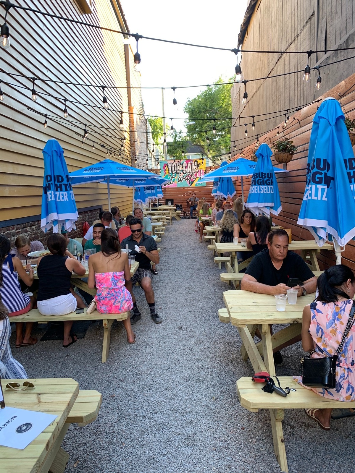 Diners eat at “the lot” located at Uptown Social, a sports bar in downtown Charleston. Born out of a need to help local restaurants weather the COVID-19 pandemic, sidewalk and other forms of outdoor dining are catching on in Charleston. Now, there’s a push to keep such outdoor dining long after the pandemic is gone. Photo provided by Keith Benjamin/Uptown Social