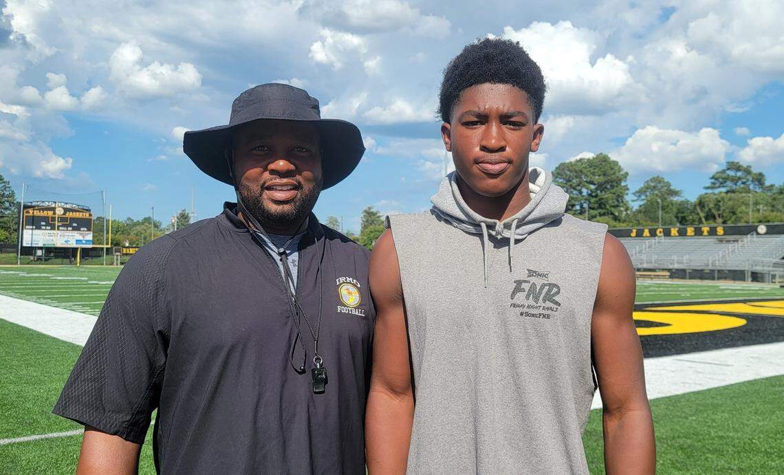 Irmo coach Aaron Brand, left, has his son AJ as the Yellow Jackets’ quarterback for next three years.