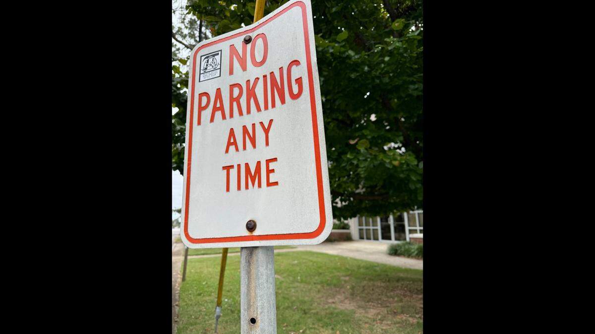 A no parking sign in Columbia, SC. Here’s what the law says about parking in front of someone’s home in the state.
