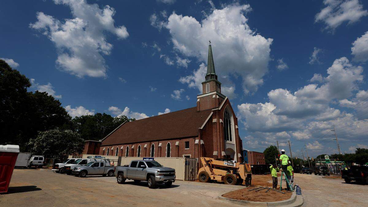 The former site of Rosewood Church is being transformed into three apartment buildings. The sanctuary of the church will include eight apartment units, one of which is built around the 30-foot-tall stained glass window from the church. The steeple will also remain in place.