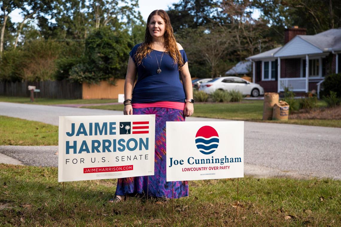 Shannon Robinson, who lives across the street from Congressman Joe Cunningham, poses for a portrait with her yard signs on Friday, October 23, 2020. She normally does not put out yard signs, but after seeing the multiple signs supporting Cunningham’s Republican opponent Nancy Mace, she felt she had to show support for her neighbor.