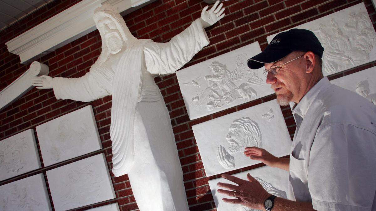 In this 2007 file photo, Bert Baker, an amateur artist, had recently finished a 7-foot-tall sculpture of Christ at Red Bank Baptist Church. The piece, which also depicts multiple scenes from Christ's life, was installed on Easter Sunday.
