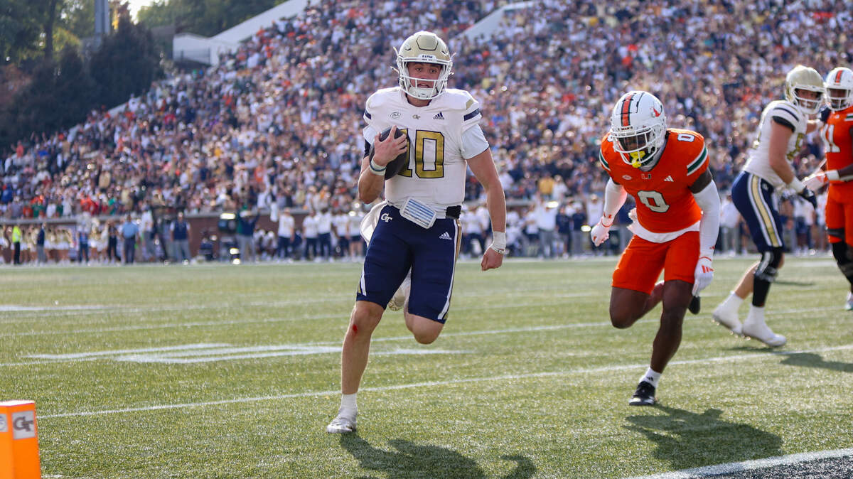 Nov 9, 2024; Atlanta, Georgia, USA; Georgia Tech Yellow Jackets quarterback Haynes King (10) runs for a touchdown against the Miami Hurricanes in the fourth quarter at Bobby Dodd Stadium at Hyundai Field.