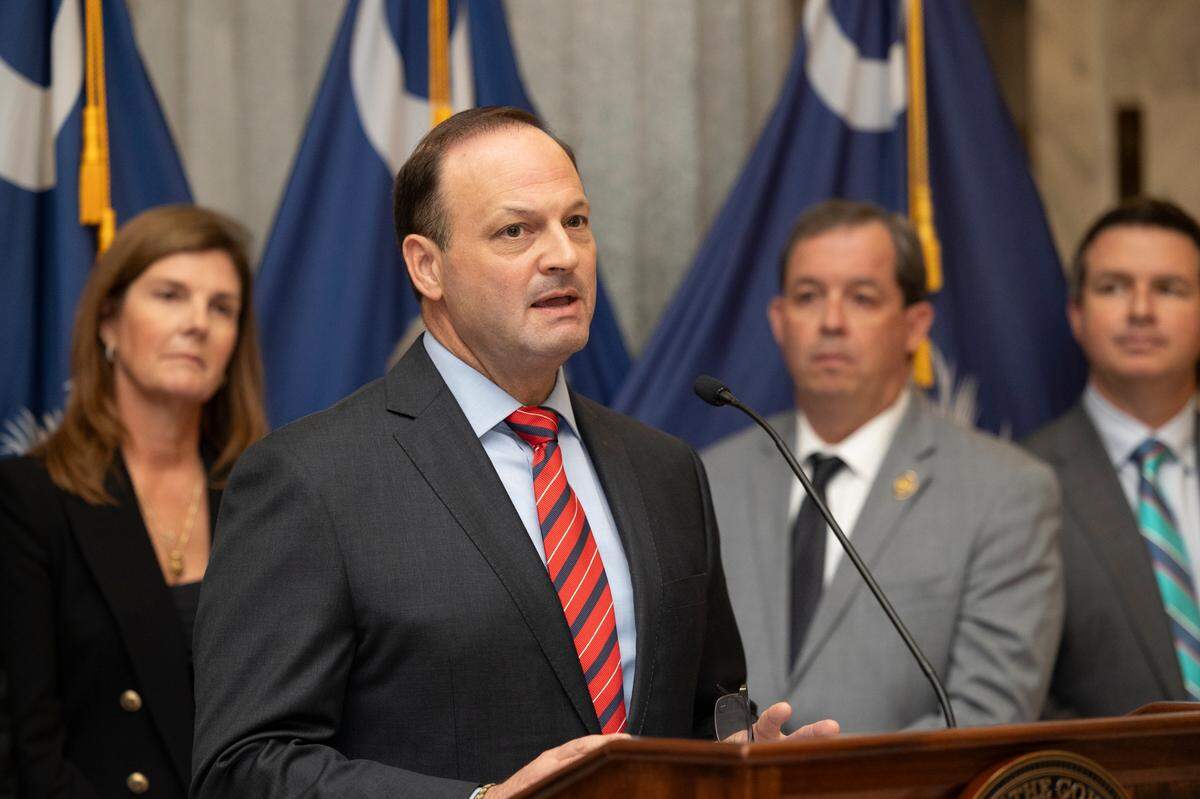 Attorney General Alan Wilson speaks about a human trafficking victim protection bill before a ceremonial bill signing in the lobby of the State House on Thursday, Aug. 15, 2024.